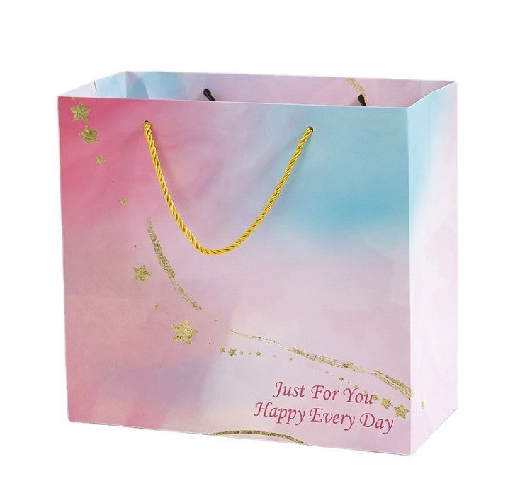 Sac cadeau en papier avec poignées 