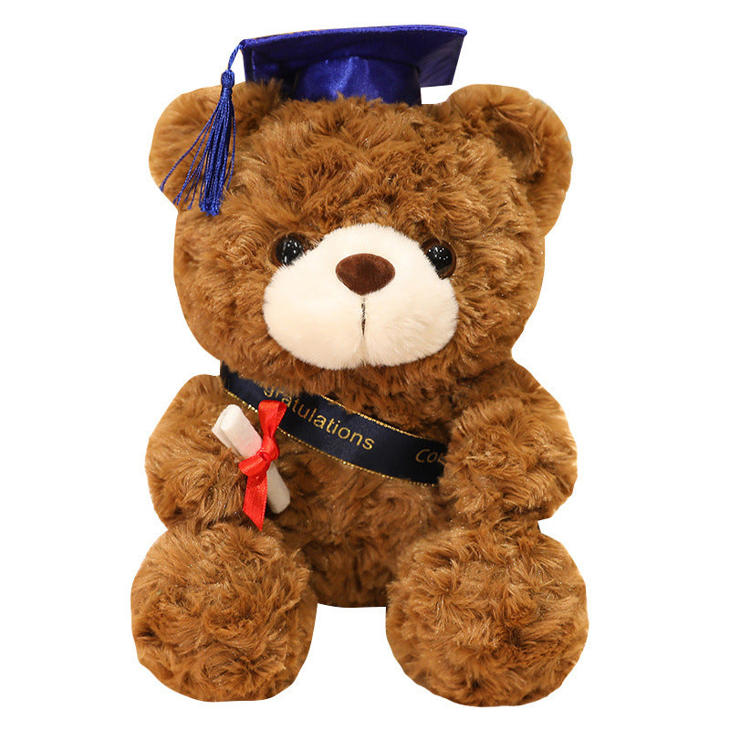 Ours en peluche avec bonnet de diplômé et pompons 